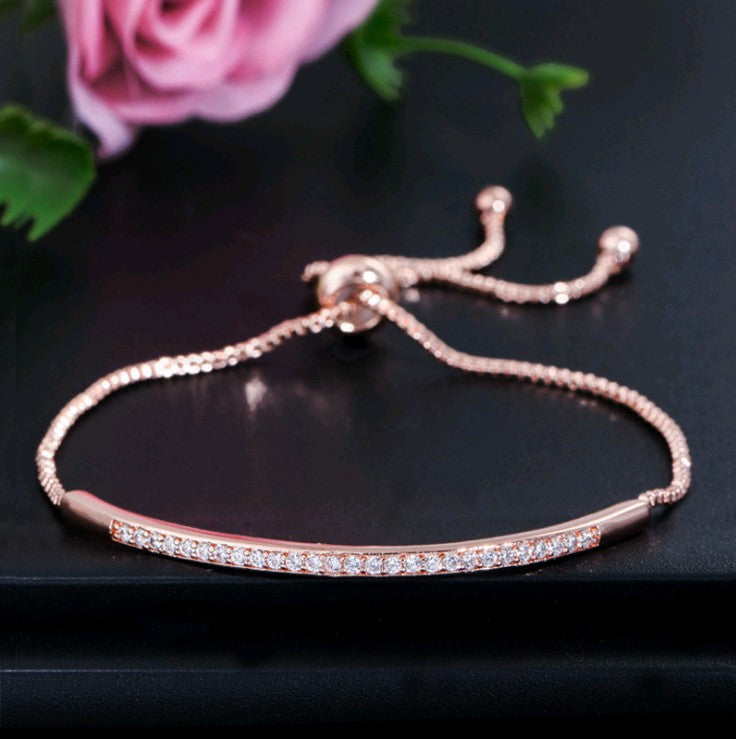 Single row curved bracelet with zircon and diamonds